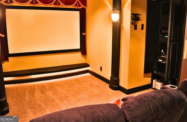 home theater with carpet floors and baseboards