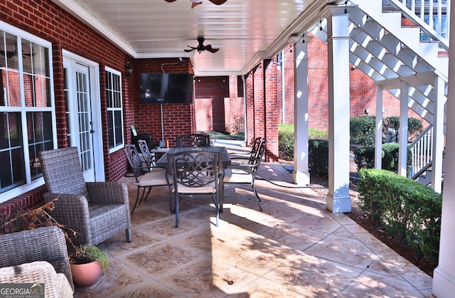 view of patio / terrace featuring a pergola, outdoor dining area, and a ceiling fan