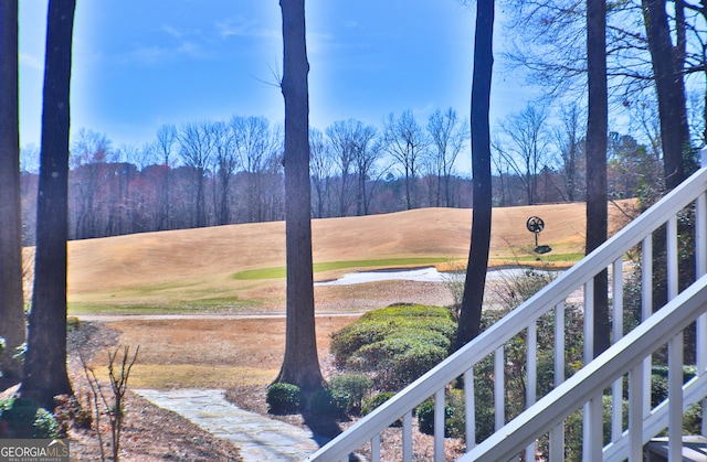 view of yard with a view of trees