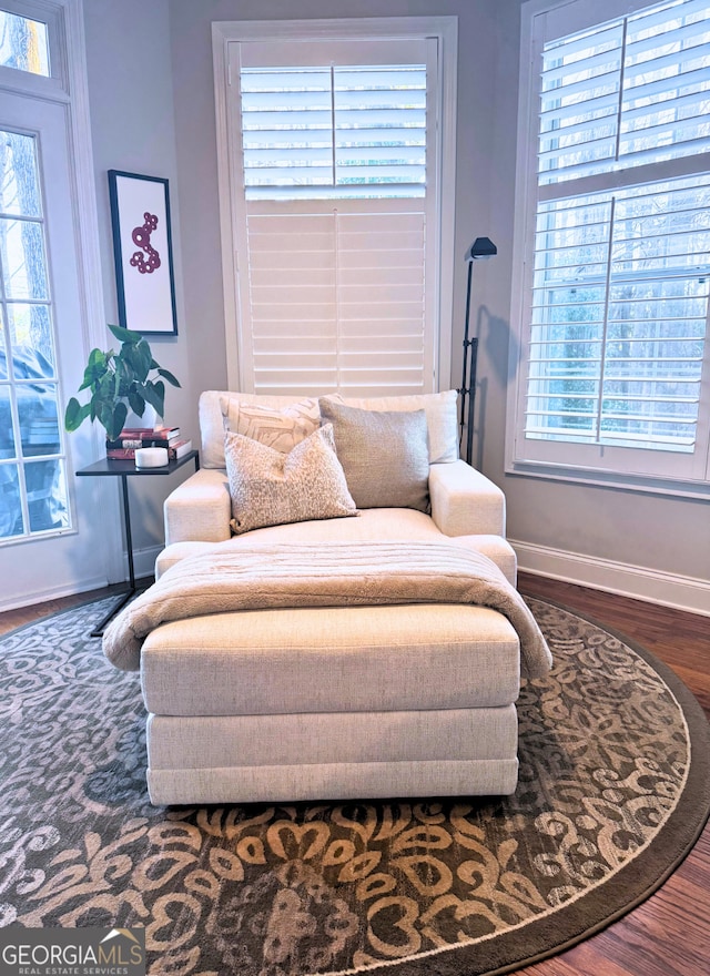 bedroom with baseboards and wood finished floors