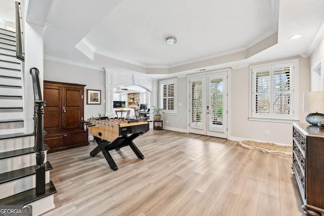 8760 Colonial Pl, Duluth, GA 30097 - rec room with a raised ceiling, light wood-style flooring, french doors, baseboards, and ornamental molding
