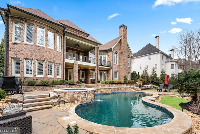 8760 Colonial Pl, Duluth, GA 30097 - swimming pool with a ceiling fan, an in-ground hot tub, and a patio area