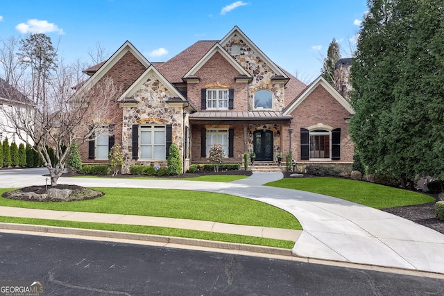 8760 Colonial Pl, Duluth, GA 30097 - craftsman-style house with a chimney, brick siding, curved driveway, a porch, and a front lawn