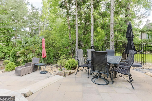 8760 Colonial Pl, Duluth, GA 30097 - view of patio with fence and outdoor dining area