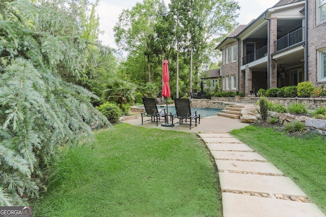 8760 Colonial Pl, Duluth, GA 30097 - view of green lawn featuring a patio and an outdoor pool