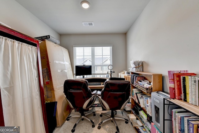 office with visible vents and carpet floors