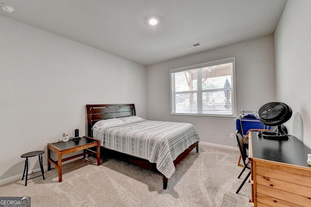 carpeted bedroom with baseboards and visible vents