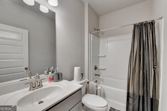 bathroom featuring vanity, shower / tub combo, and toilet