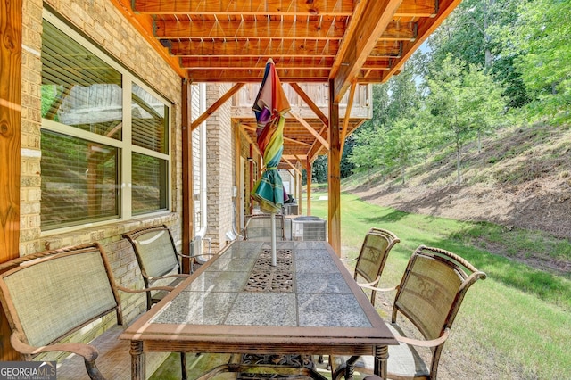 view of patio / terrace with central AC unit and outdoor dining area