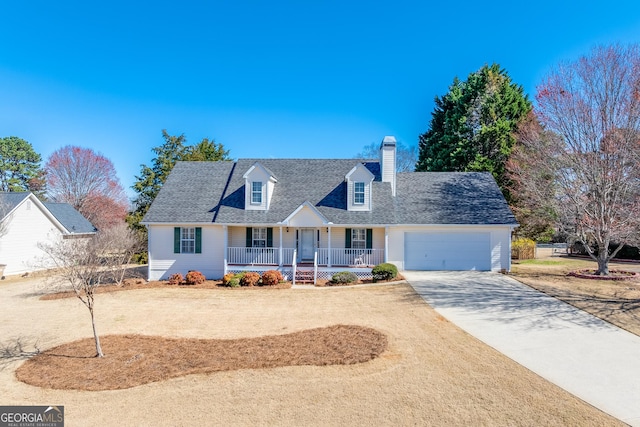 cape cod-style house featuring roof with shingles, a chimney, covered porch, concrete driveway, and a garage