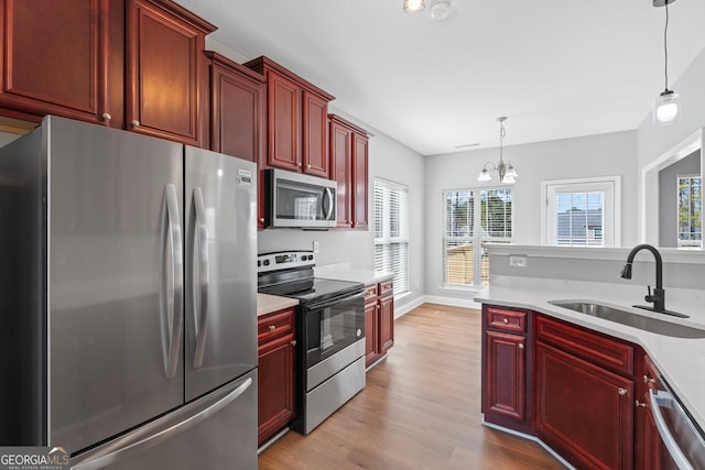 kitchen featuring dark brown cabinets, appliances with stainless steel finishes, and a sink