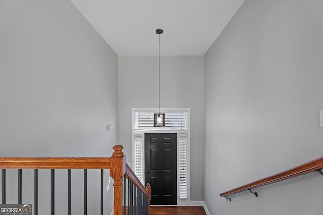 foyer featuring wood finished floors and baseboards