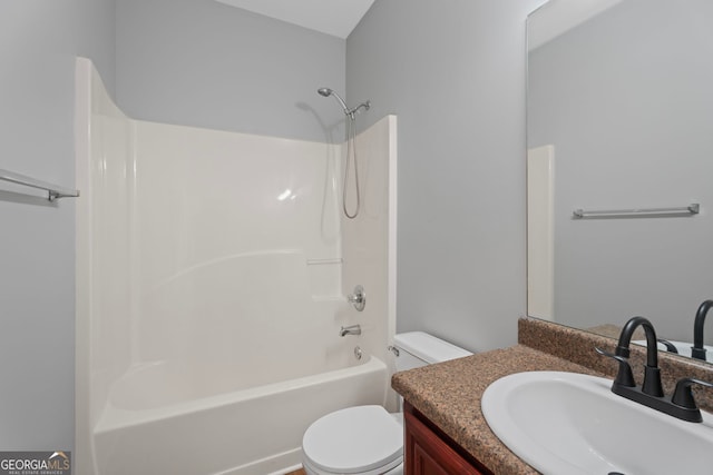 bathroom featuring toilet, shower / bath combination, and vanity