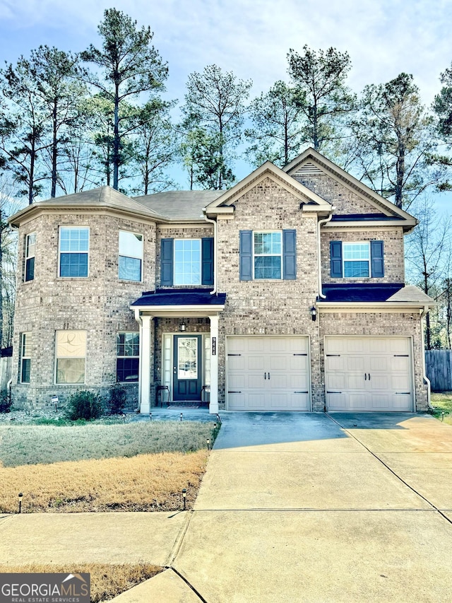 view of front of property featuring concrete driveway, brick siding, and an attached garage