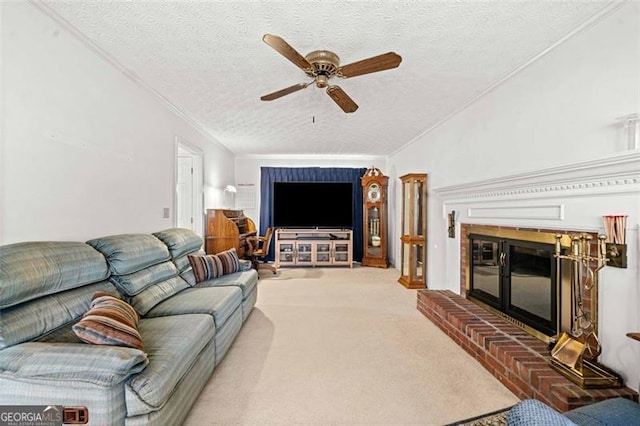 carpeted living area featuring ornamental molding, a brick fireplace, ceiling fan, and a textured ceiling