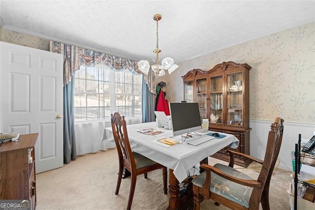 dining space with light carpet, a textured ceiling, a notable chandelier, and wallpapered walls