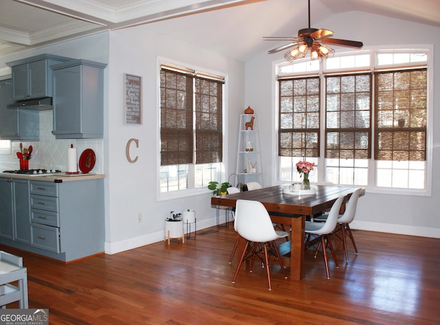 dining space featuring lofted ceiling, dark wood-type flooring, a ceiling fan, and baseboards