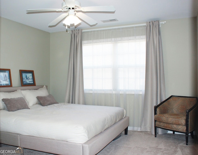 bedroom with ceiling fan, carpet, and visible vents