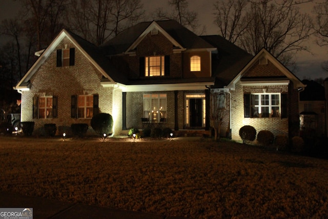 view of front facade featuring brick siding