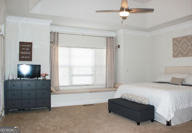 bedroom featuring ceiling fan, carpet floors, and ornamental molding