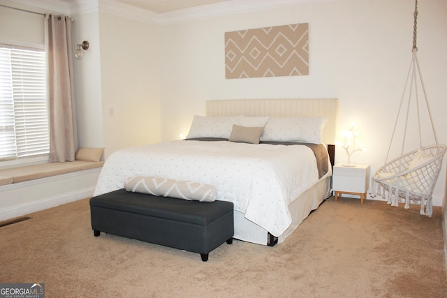 bedroom featuring carpet floors, multiple windows, visible vents, and crown molding