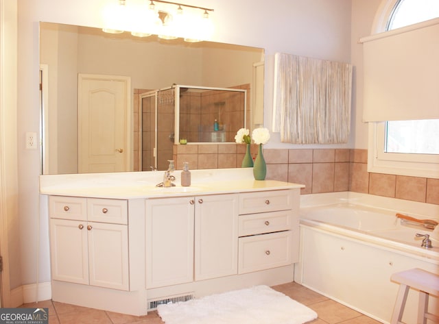 bathroom with a garden tub, visible vents, a stall shower, vanity, and tile patterned flooring