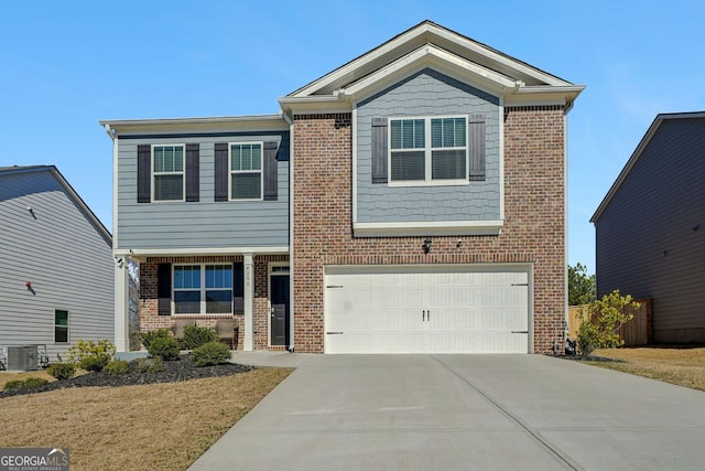 craftsman-style house with a garage, brick siding, driveway, and central AC