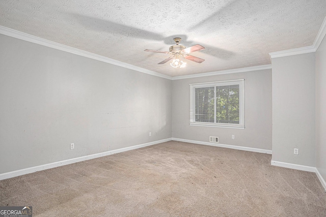 empty room with visible vents, ornamental molding, a ceiling fan, light carpet, and baseboards