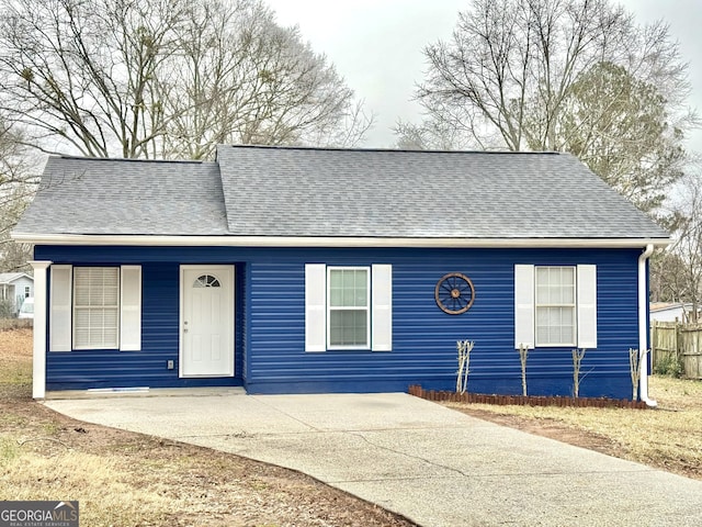 view of front of home featuring a shingled roof