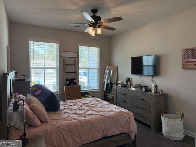 bedroom featuring a ceiling fan and wood finished floors