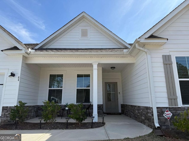 property entrance featuring covered porch