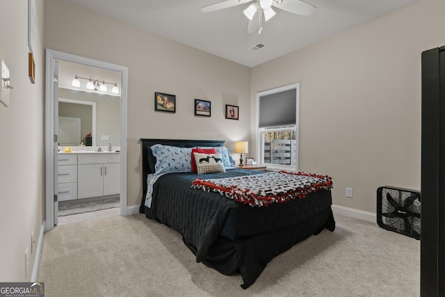 carpeted bedroom featuring a ceiling fan, baseboards, and connected bathroom