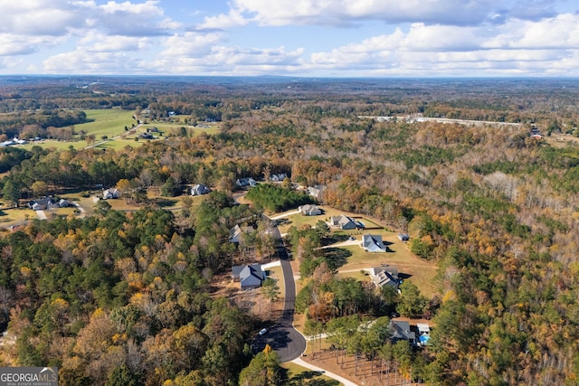 aerial view featuring a view of trees