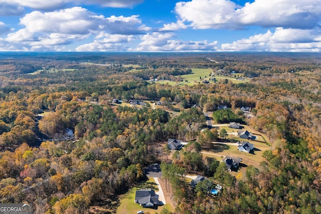 drone / aerial view with a view of trees