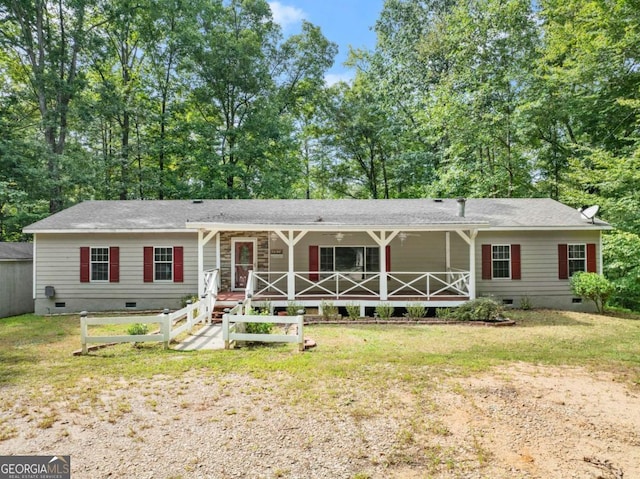 ranch-style house featuring crawl space, covered porch, and a front lawn