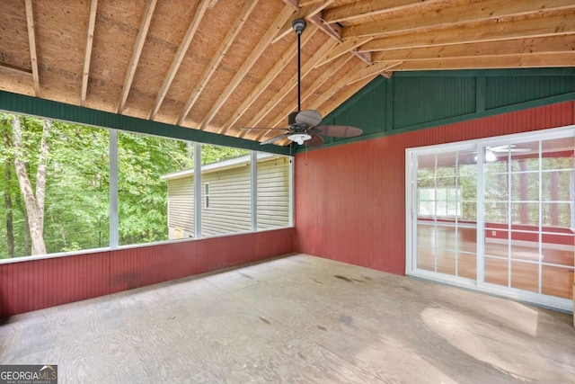 unfurnished sunroom with vaulted ceiling, a wealth of natural light, and a ceiling fan