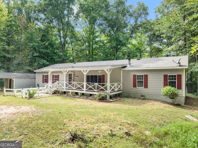 ranch-style house featuring a front yard, covered porch, fence, and crawl space