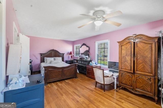 bedroom featuring a ceiling fan and light wood finished floors