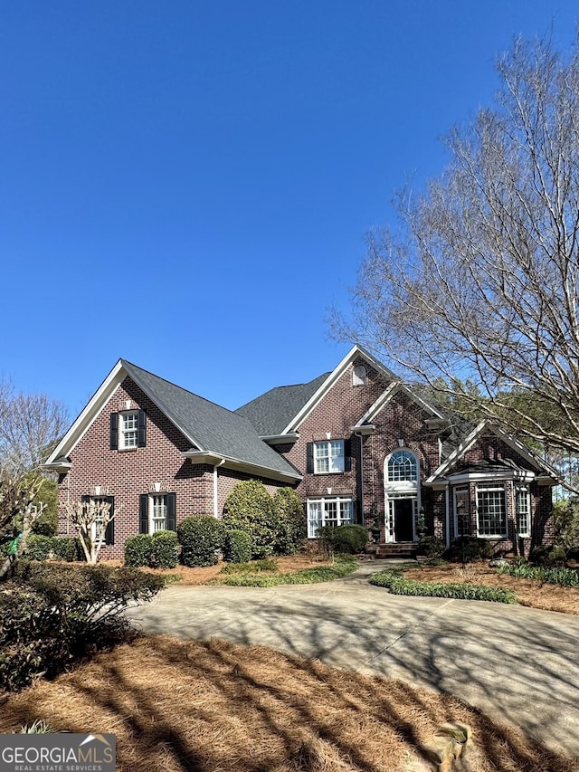 view of front of home featuring brick siding