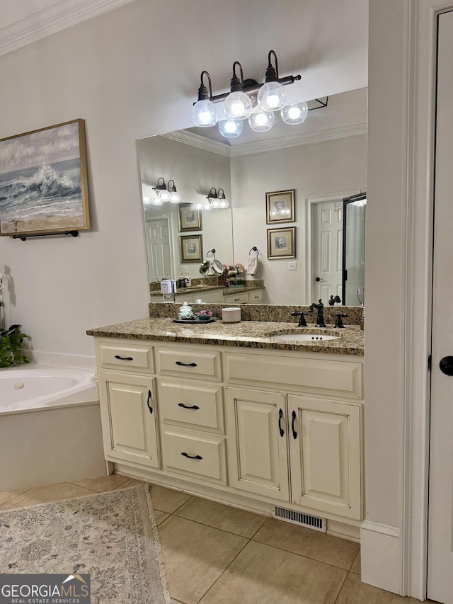 bathroom featuring tile patterned flooring, visible vents, crown molding, and a garden tub