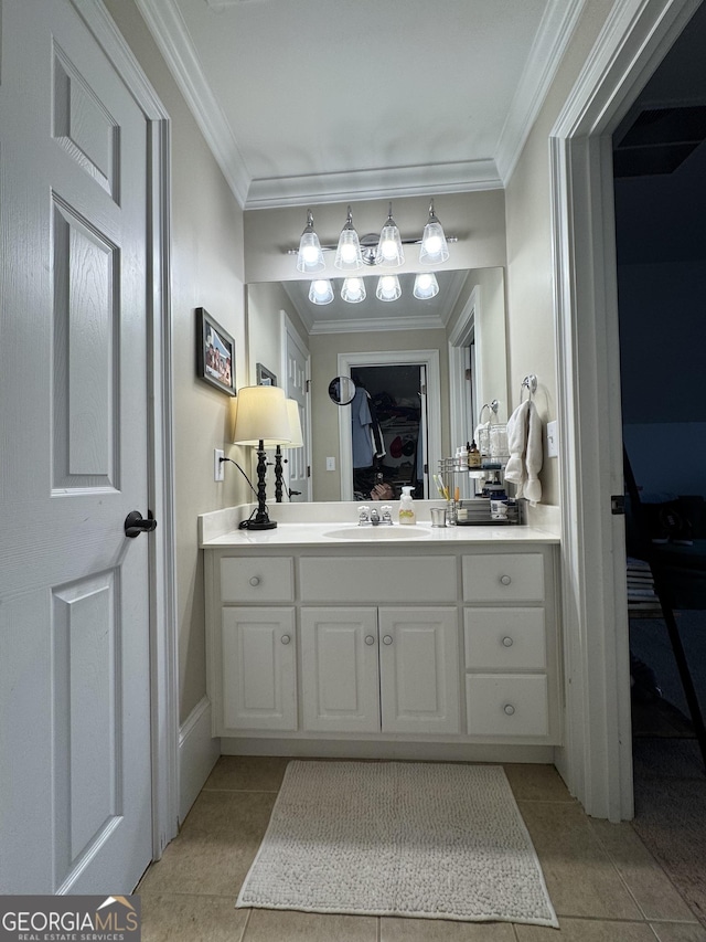 ensuite bathroom featuring ornamental molding, tile patterned flooring, ensuite bath, and vanity