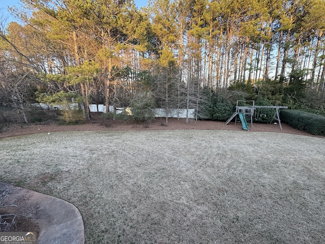 view of yard featuring playground community