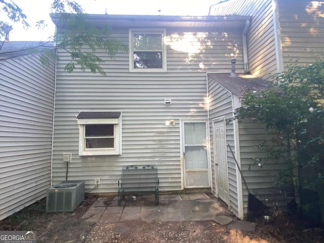 rear view of property featuring a patio area and central AC unit