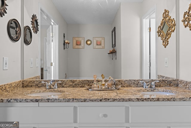 bathroom with double vanity and a sink