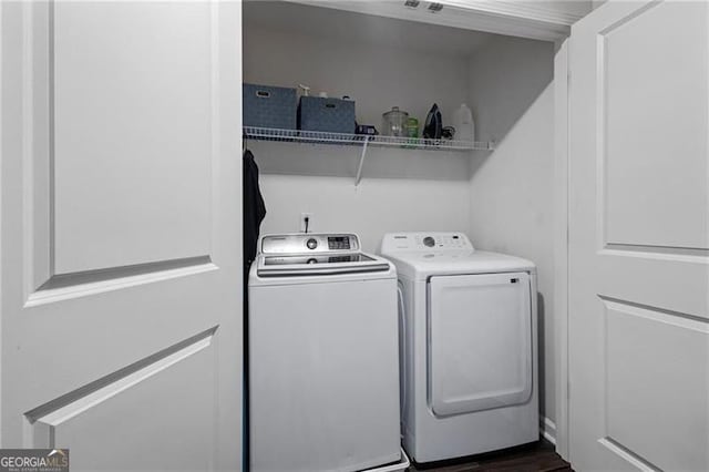 clothes washing area with laundry area and separate washer and dryer