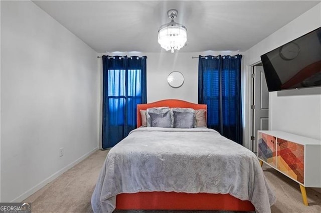 carpeted bedroom featuring baseboards