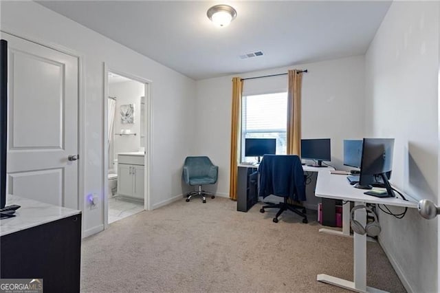 home office featuring carpet, visible vents, and baseboards