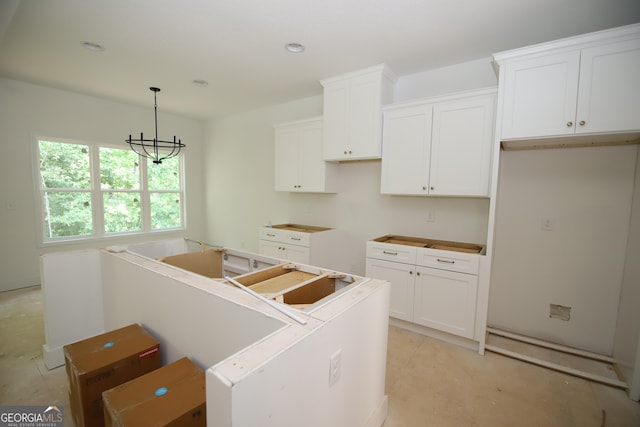 517 Tradition Pl, Lagrange, GA 30241 - kitchen featuring a center island, white cabinets, decorative light fixtures, recessed lighting, and a chandelier
