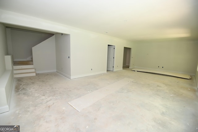 519 Tradition Pl, Lagrange, GA 30241 - empty room with stairs and unfinished concrete floors