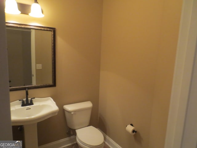2026 Pin Oak Ter, Bonaire, GA 31005 - bathroom with toilet, baseboards, and a sink